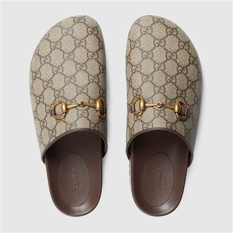 Gucci Pantofola donna GG Supreme con Morsetto.